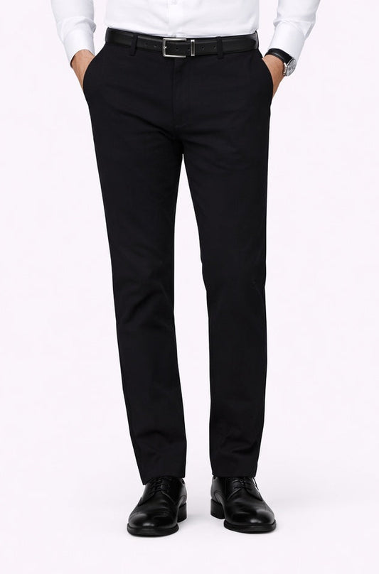 Man wearing a white dress shirt and black pants on a white background