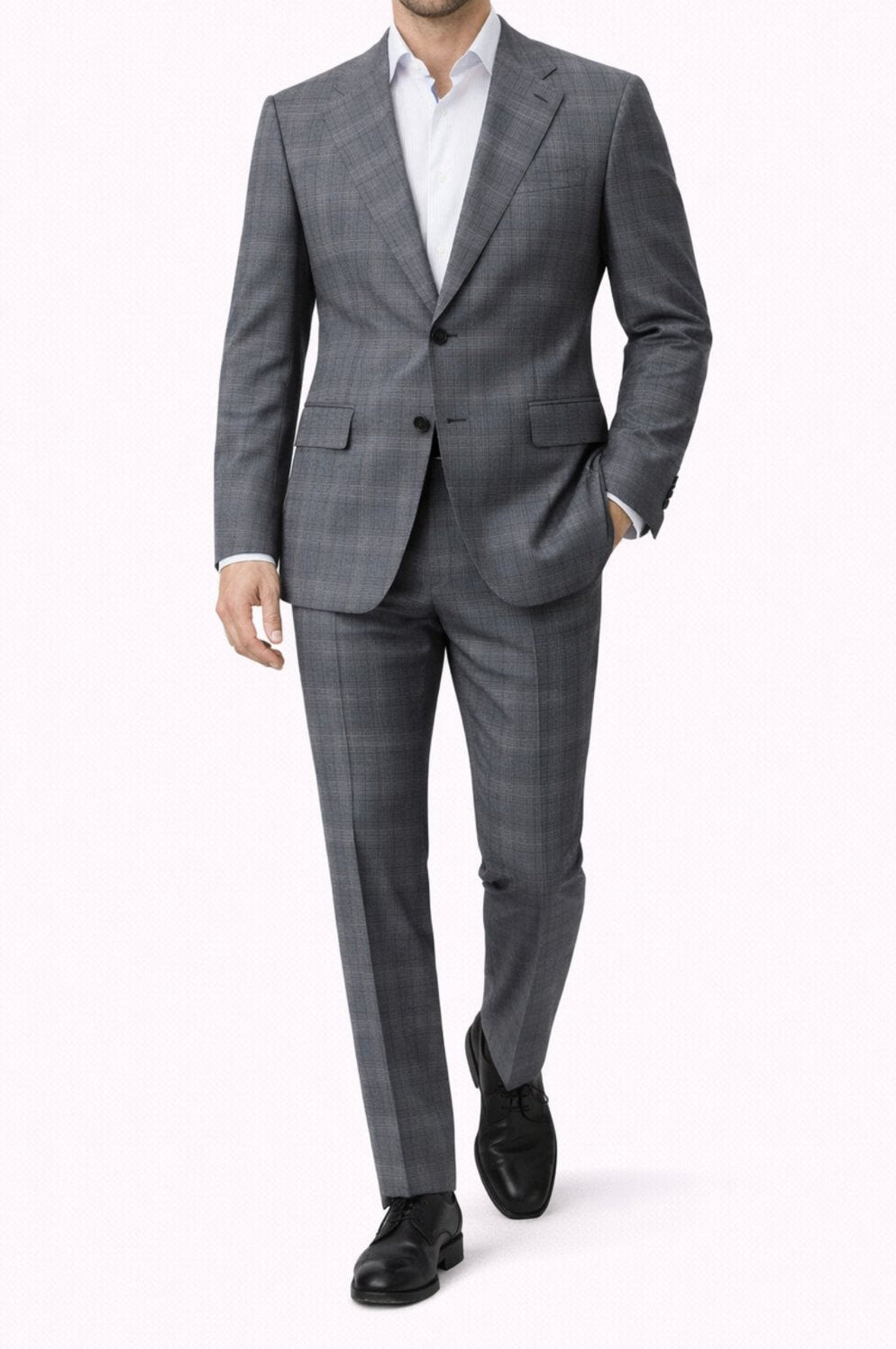 Man wearing a gray suit with a white shirt on a white background